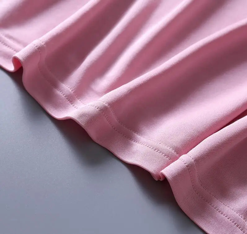 Top in pura seta naturale, con collo drappeggiato, maniche corte