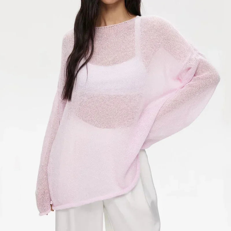 Maglia a trama larga, stile minimal chic, ampia vestibilità.  Per le serate di Primavera
