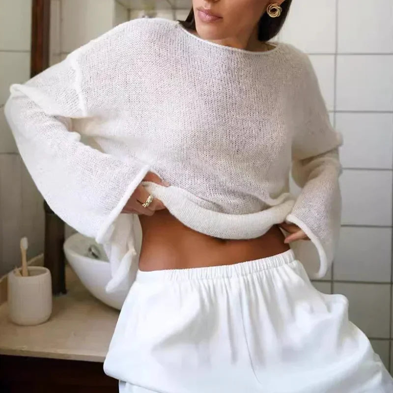 Maglia a trama larga, stile minimal chic, ampia vestibilità.  Per le serate di Primavera