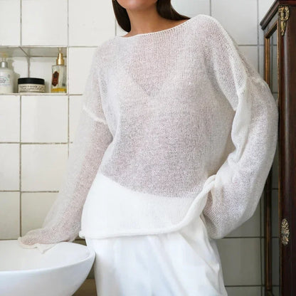 Maglia a trama larga, stile minimal chic, ampia vestibilità.  Per le serate di Primavera