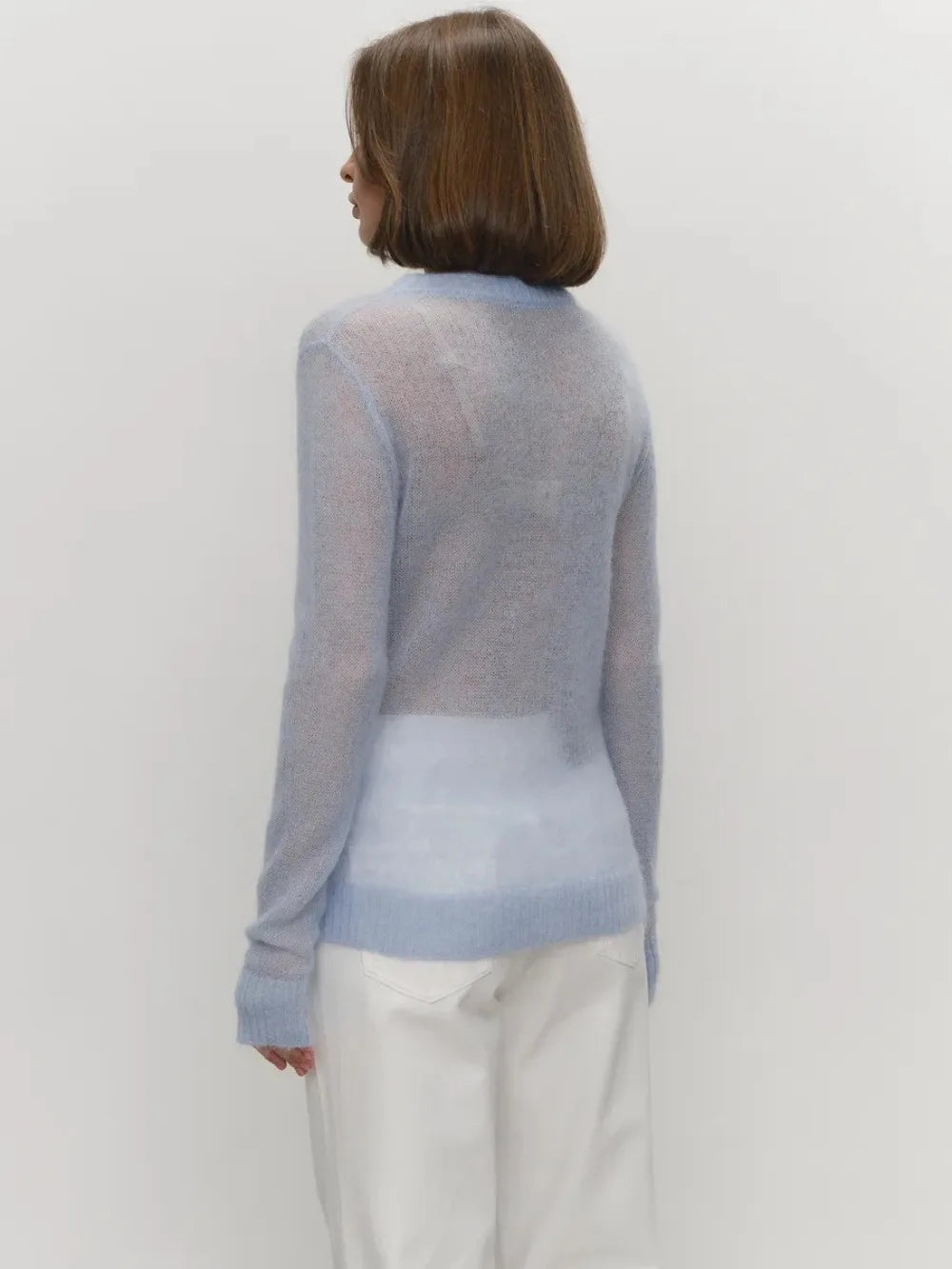 Maglia in misto Mohair, morbida e traforata, scollo tondo, con vestibilità normale e  aspetto minimal fashion