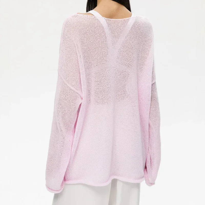 Maglia a trama larga, stile minimal chic, ampia vestibilità.  Per le serate di Primavera