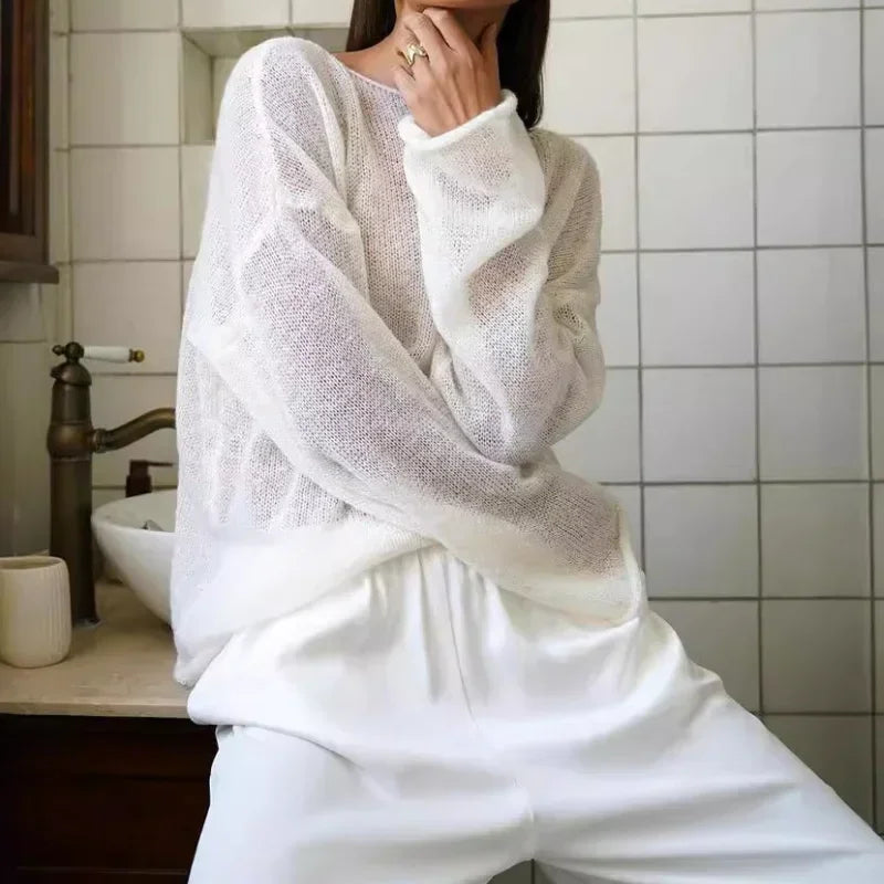 Maglia a trama larga, stile minimal chic, ampia vestibilità.  Per le serate di Primavera